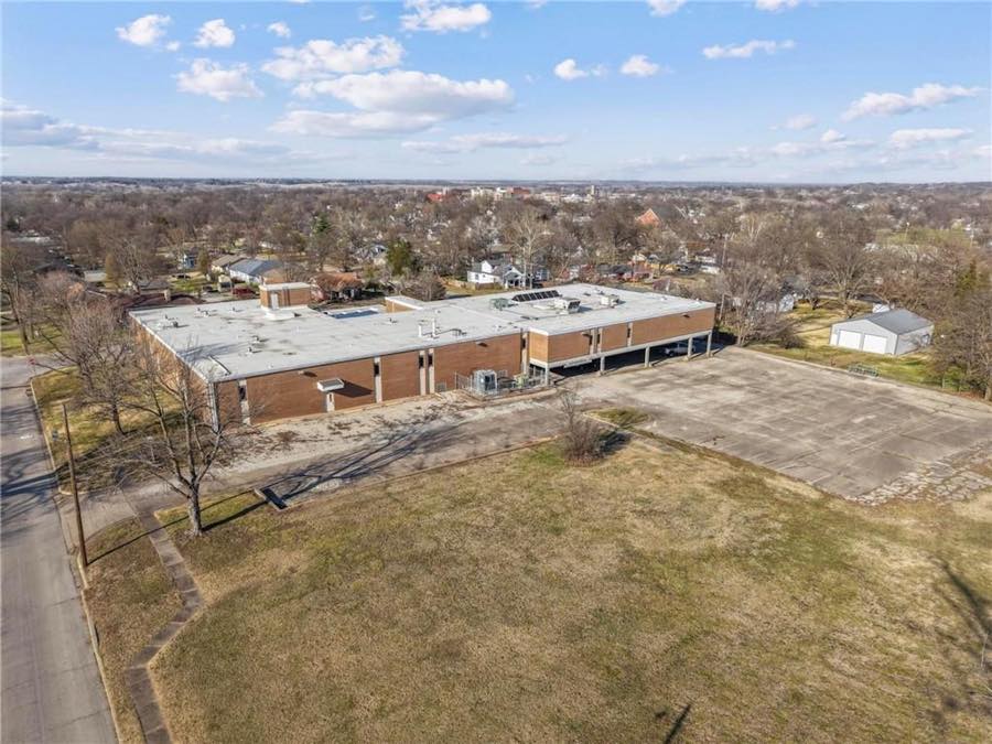 Drone view: building and open lot